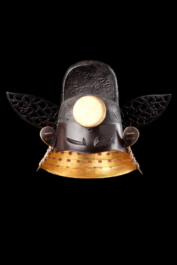 Tōkanmuri-style helmet with a black cloud pattern, golden sun disc and Yamanouchi clan crest, from the collection of Samurai Museum Berlin.