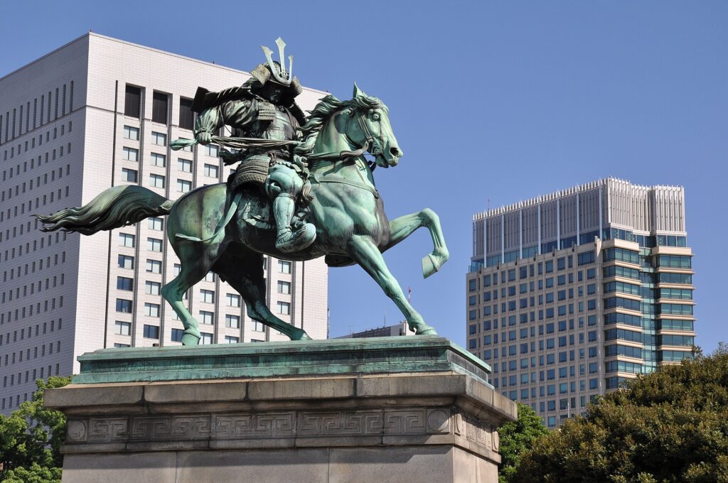 Bronze equestrian statue of Kusunoki Masashige against the Tokyo Imperial Palace skyline