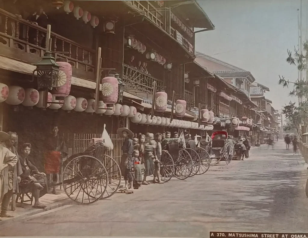 Photograph of Matsushima street in Osaka, 1890 — rickshaws and lanterns