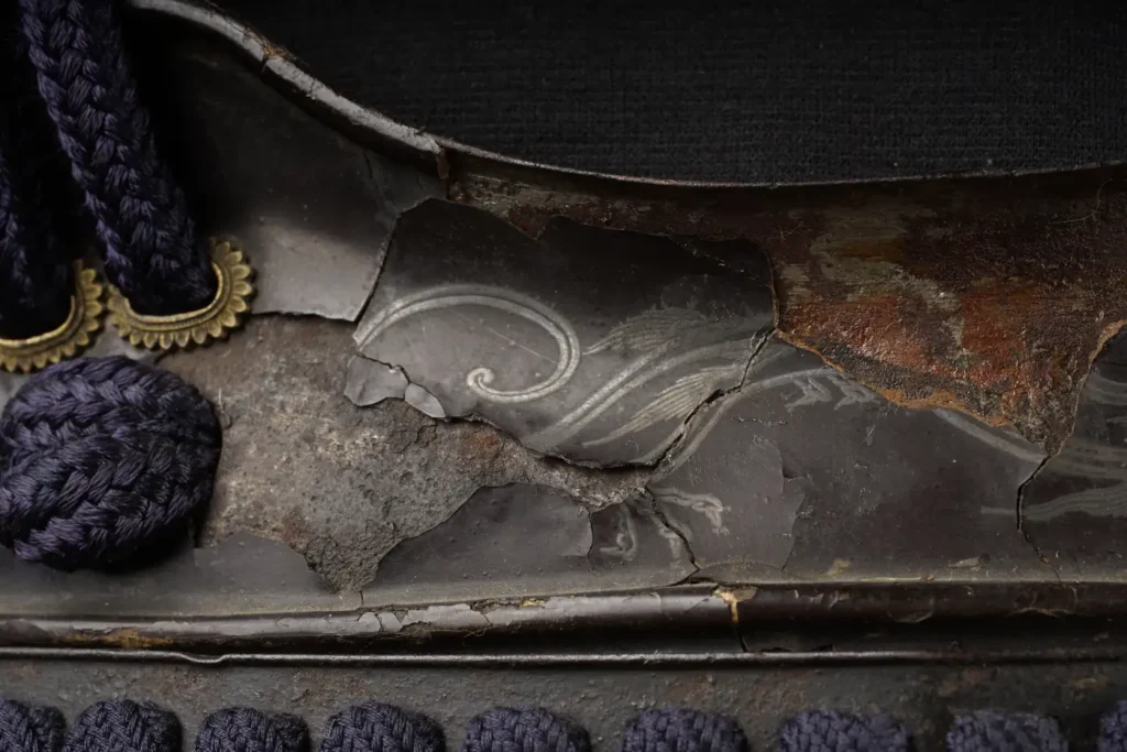 Odoshi lacing of an ō-yoroi with lacquer damage and violet silk cords