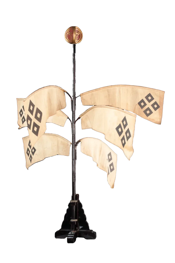 Sashimono of 1681 with lozenge crest, black lacquer and gilt finial